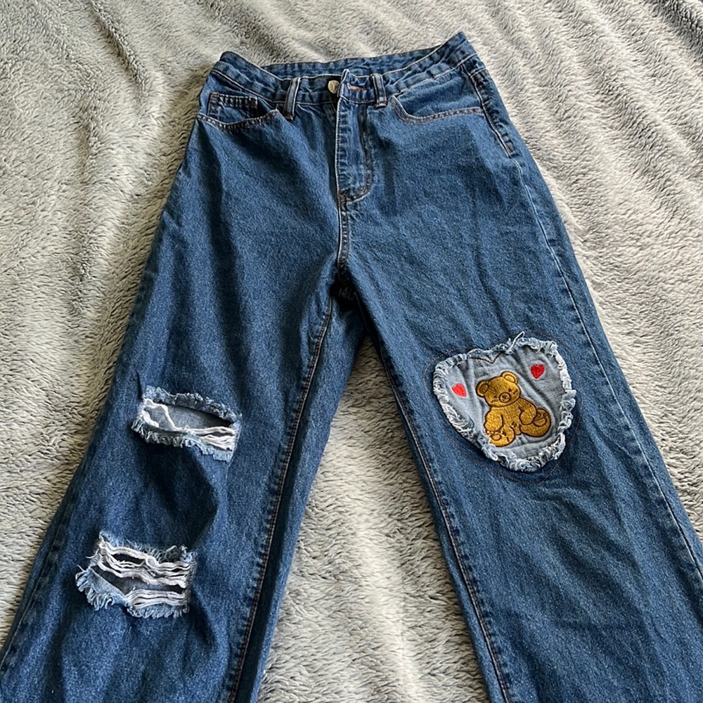 high waisted dark wash boyfriend slightly ripped jeans with cute bear patch